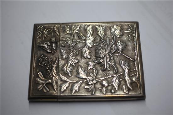 An early 20th century Chinese silver card case with embossed decoration and vacant cartouche, 10.4cm.